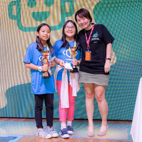 Kids listening to coding lesson at CodeFest Singapore