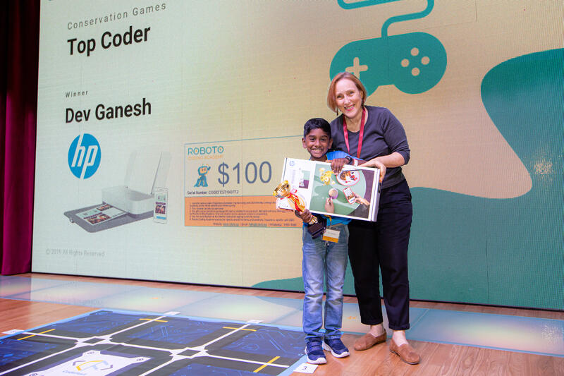 Top Coder winner receiving award at CodeFest ceremony