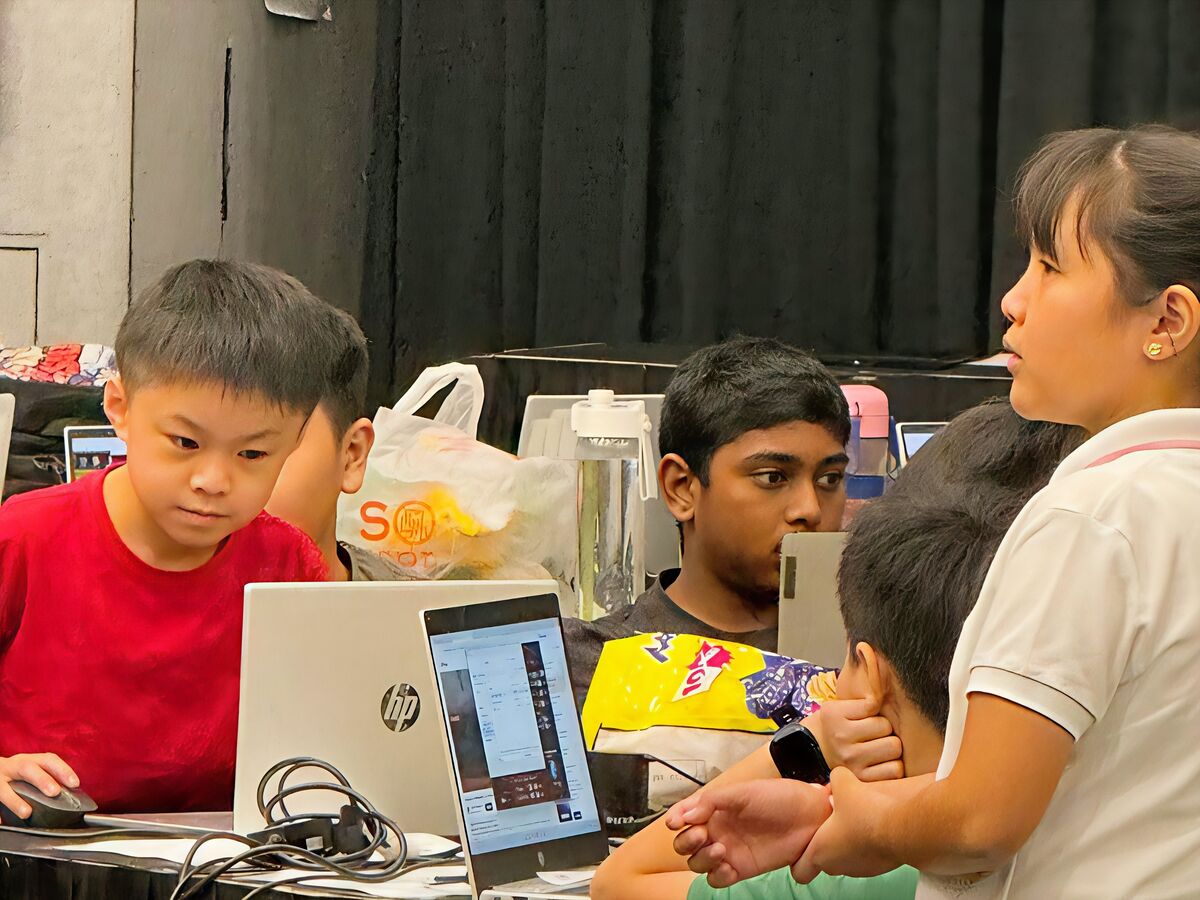 Coach and students discussing strategy at RoboCup 2026