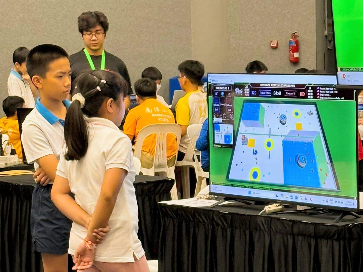 Students watching CoSpace Rescue simulation on big screen