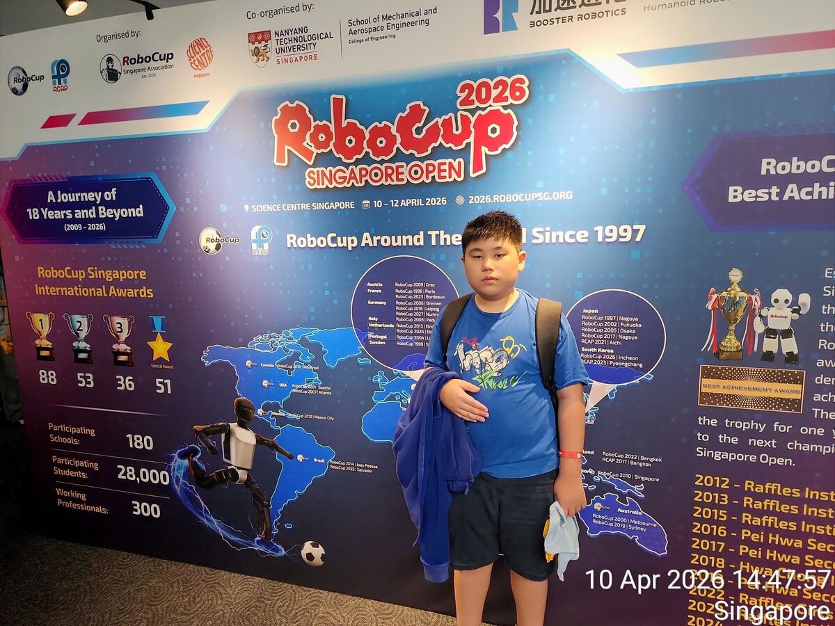 Student at RoboCup 2026 event wall