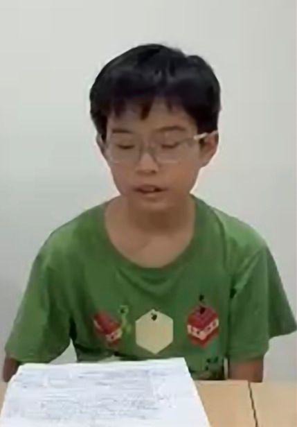 Student reading competition notes at RoboCup 2026