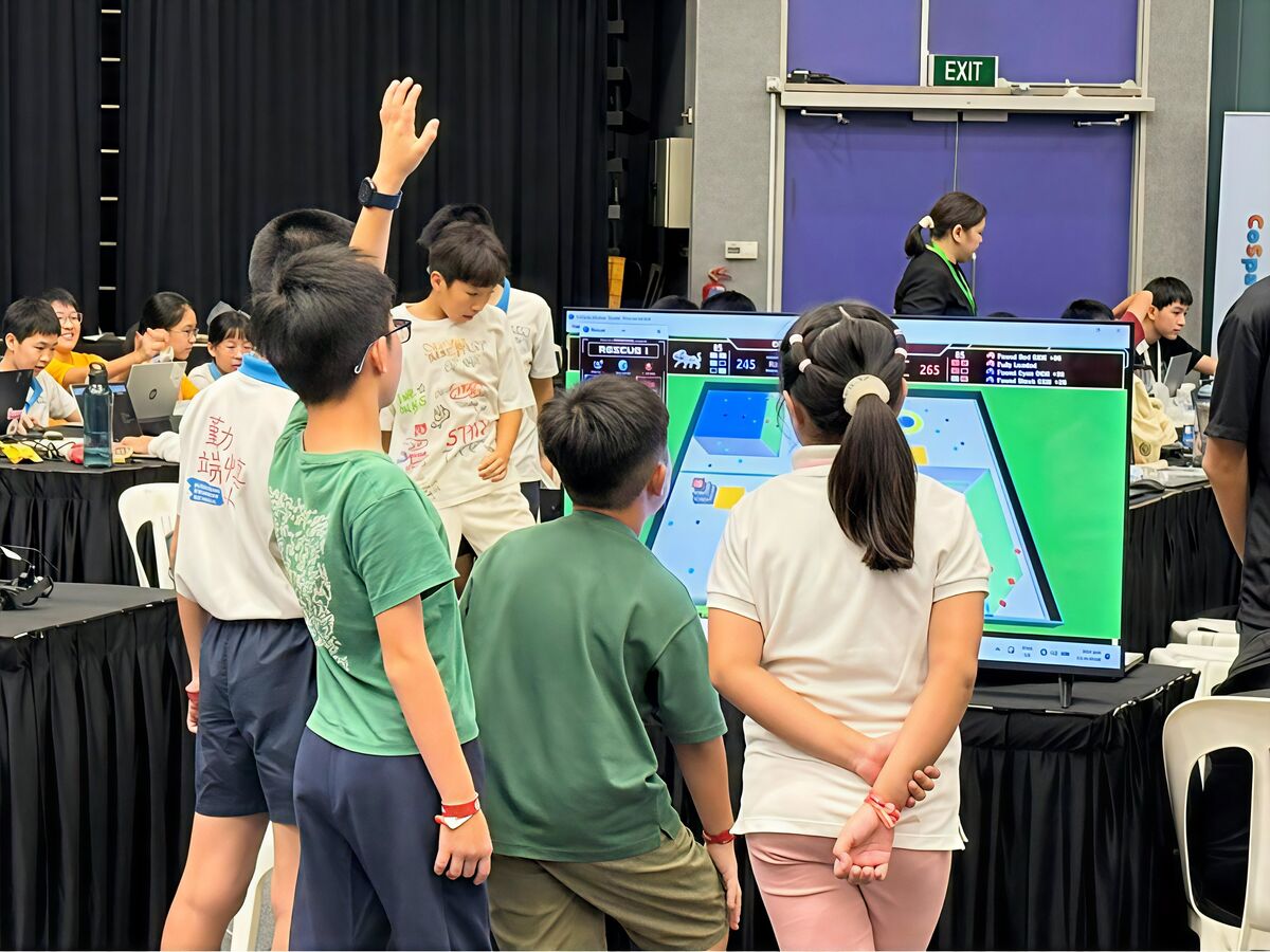 Students watching CoSpace Rescue simulation on screen