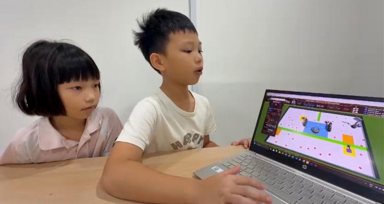 Two students watching CoSpace Rescue simulation together