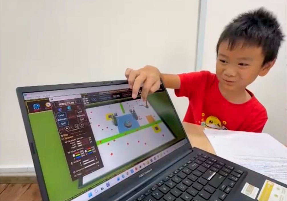 Young student practicing CoSpace Rescue on screen