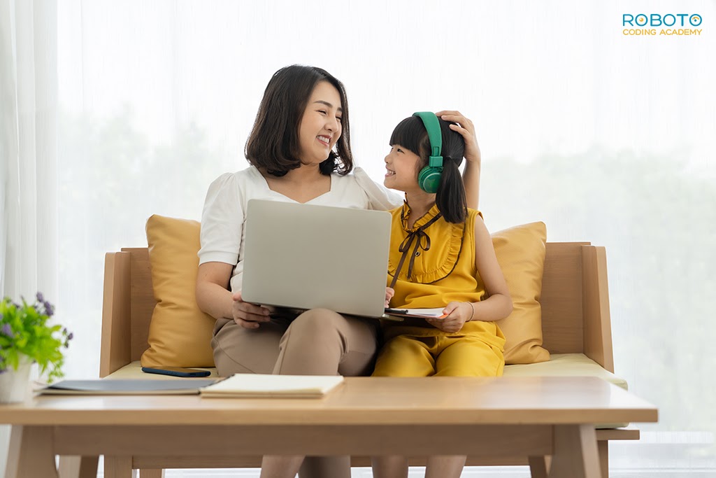 Mother-and-daughter-using-a-laptop-for-coding-class