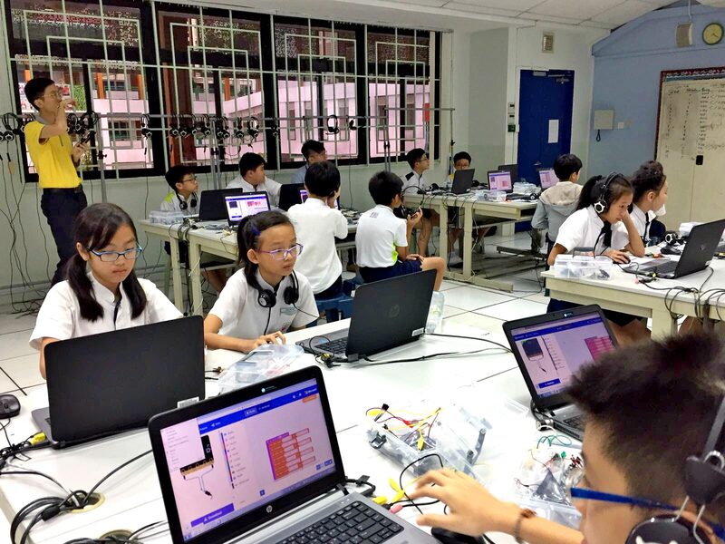 Students presenting their coding project at school