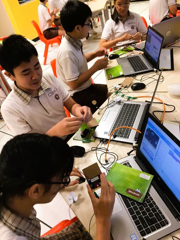 Students engaged in a drone programming session