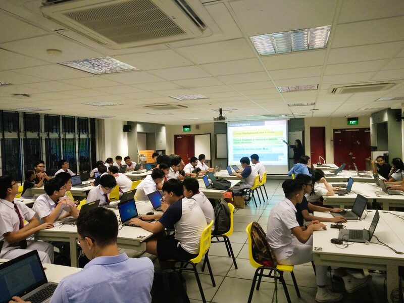 Secondary school students in a coding lecture session